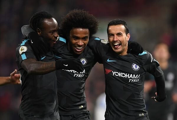 Chelsea Players Celebrate Pedro's Goal in Premier League Match Against Huddersfield Town