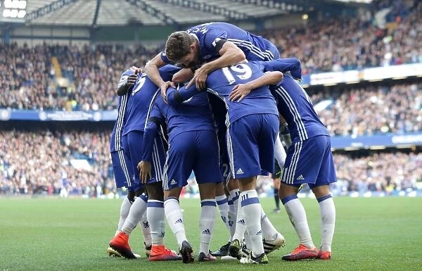 Chelsea's Double Delight: Eden Hazard and Teammates Celebrate at Stamford Bridge after Scoring Against Leicester City (Premier League)