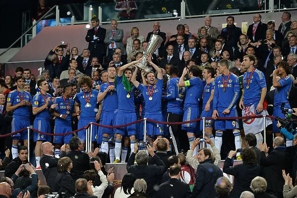 Chelsea's Juan Mata Lifts the UEFA Europa League Trophy: Chelsea FC Victory over Benfica (Amsterdam Arena, May 16, 2013)