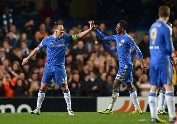 Chelsea's Terry and Mikel Celebrate Second Goal in Europa League Victory over Steaua Bucharest (14th March 2013)