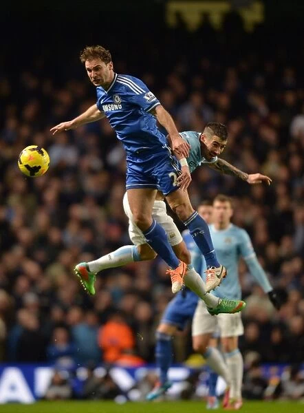 Clash in the Sky: Ivanovic vs. Kolarov - A Premier League Battle for Possession (Manchester City vs. Chelsea, 2014)