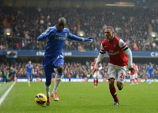 Clash at Stamford Bridge: Ba vs. Gibbs in Intense Battle for the Ball (Chelsea vs. Arsenal, Barclays Premier League, 2013)