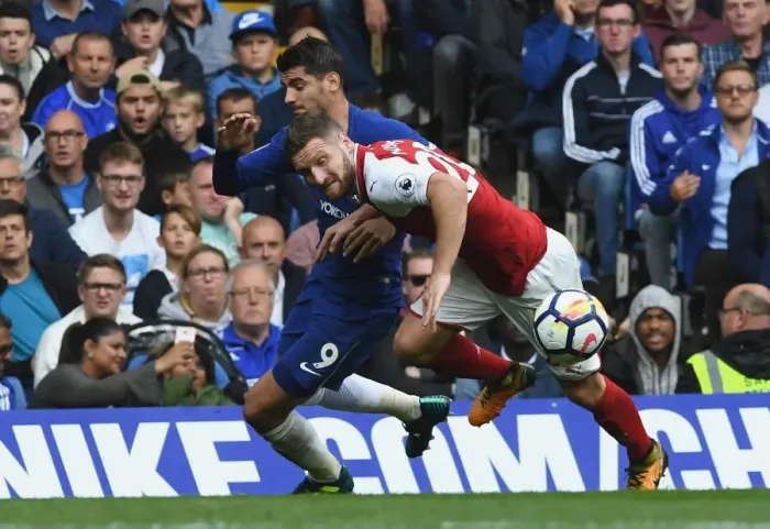 Framed Print : Clash at Stamford Bridge: Morata vs Mustafi - Premier League Showdown