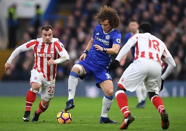 David Luiz Stands Firm: Chelsea vs Stoke City Clash - Luiz Fends Off Diouf and Shaqiri Pressure