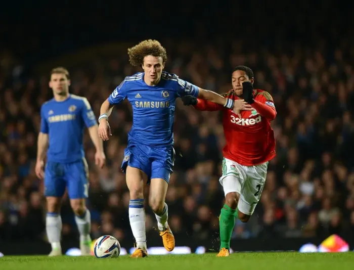 Framed Print : David Luiz vs. Jonathan de Guzman: A Fierce Battle for Ball Possession in the Chelsea vs. Swansea Capital One Cup Semi-Final (January 9, 2013)