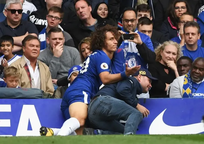 Framed Print : David Luiz's Unusual Opponent: Fan Collision at Stamford Bridge During Chelsea vs Arsenal Match Framed Print : David Luiz's Unusual Opponent: Fan Collision at Stamford Bridge During Chelsea vs Arsenal Match