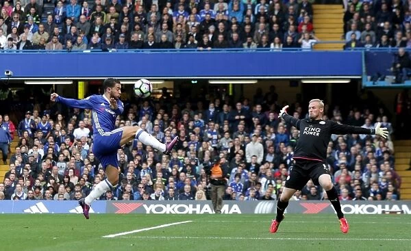 Hazard vs. Schmeichel: A Premier League Showdown - Eden Hazard Attempts to Score Past Kasper Schmeichel at Stamford Bridge