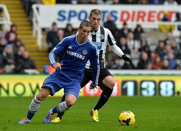 Intense Battle for Ball Possession: Fernando Torres vs. Davide Santon - Newcastle United vs. Chelsea (November 2013)