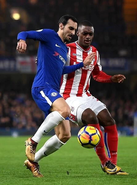 Intense Battle for Possession: Chelsea's Davide Zappacosta vs Stoke City's Julien Ngoy