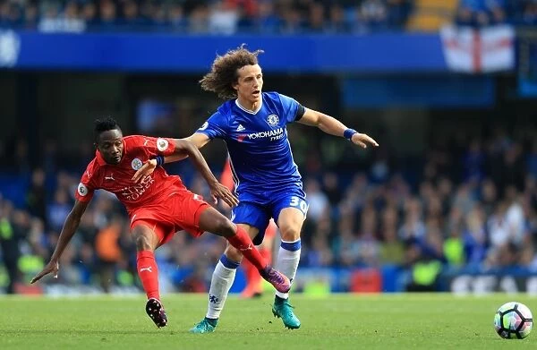 Intense Premier League Rivalry: David Luiz vs. Ahmed Musa - Battle for Ball Possession at Stamford Bridge