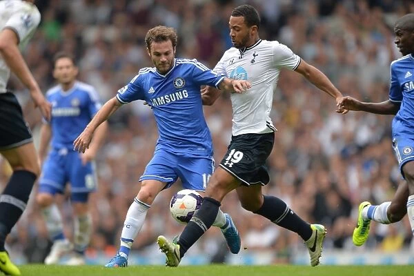 Intense Rivalry: Juan Mata vs. Mousa Dembele - A Battle for Supremacy in the Premier League Clash between Chelsea and Tottenham Hotspur (September 2013)