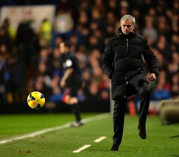 Jose Mourinho in Action: Chelsea Boss Masterfully Controls Ball on Touchline Amidst Chelsea vs. West Ham United, Barclays Premier League (January 29, 2014)