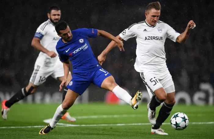 Framed Print : Pedro vs Rzezniczak: A Battle for Possession in the UEFA Champions League Framed Print : Pedro vs Rzezniczak: A Battle for Possession in the UEFA Champions League