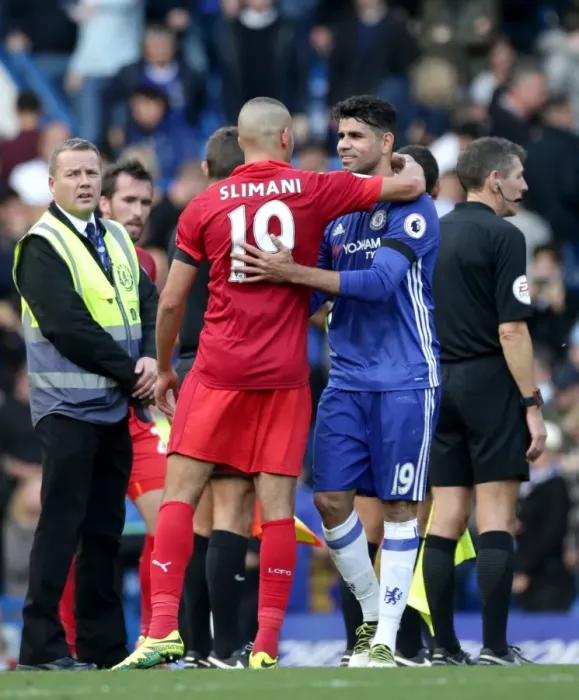 Framed Print : Sportsmanship on the Pitch: Costa and Slimani's Heartwarming Embrace After Chelsea vs. Leicester City