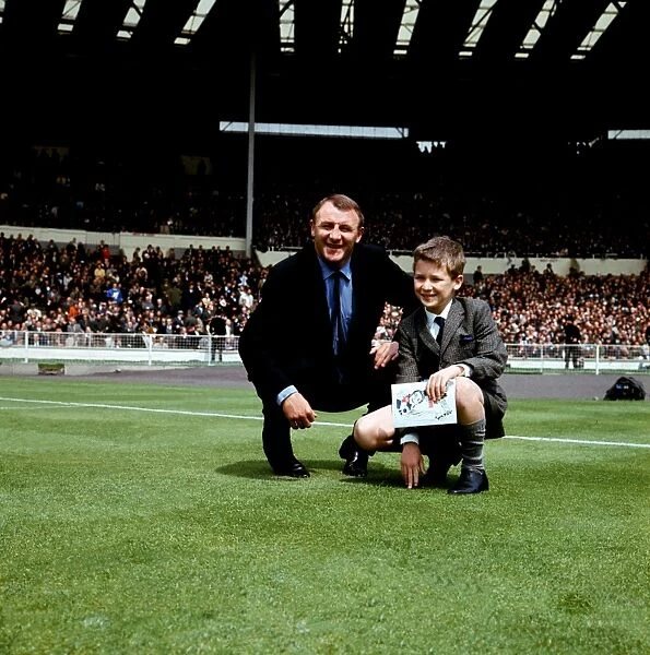 Tommy Docherty and a Young Fan: A Historic Moment on the Wembley Pitch before the FA Cup Final between Chelsea and Tottenham Hotspur (1960s)