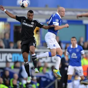 Print of Ashley Cole and Steven Naismith in action