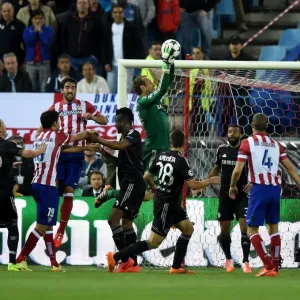 Print of Mark Schwarzer and Raul Garcia in mid-air, battling for the ball