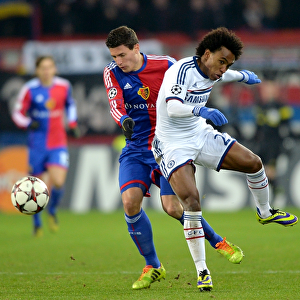 Battle for the Ball: Willian vs. Schar in UEFA Champions League Clash between Chelsea and FC Basel