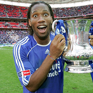 Chelsea's Glory: FA Cup Victory - Didier Drogba Celebrates with the Trophy (May 2007)