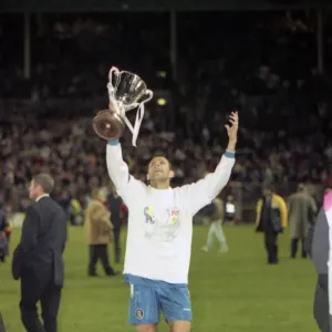 Chelsea's Gus Poyet Hoists the UEFA European Cup-Winners Cup Print Chelsea's Gus Poyet Hoists the UEFA European Cup-Winners Cup Print