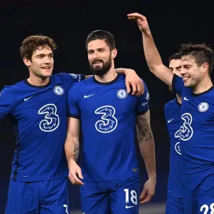 Print of Olivier Giroud and Marcos Alonso Celebrating at Stamford Bridge