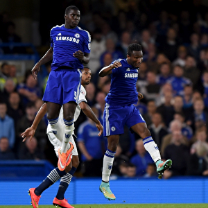 Chelsea's Zouma and Mikel Take on Bolton's Beckford: Intense Moment from the Capital One Cup Third Round at Stamford Bridge