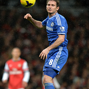 Frank Lampard Soaring High: Heading the Ball Against Arsenal in the Premier League Rivalry (December 23, 2013)