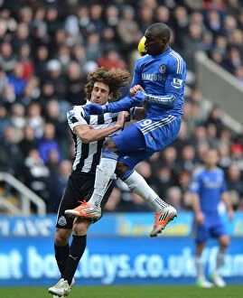 Images Dated 2nd February 2013: Aerial Battle: Coloccini vs. Ba in Intense Newcastle United vs. Chelsea Clash (February 2013)