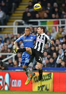 Newcastle United v Chelsea 2nd February 2013 Collection: Battle for the Ball: Bertrand vs Debuchy - Intense Aerial Clash in Chelsea vs Newcastle United