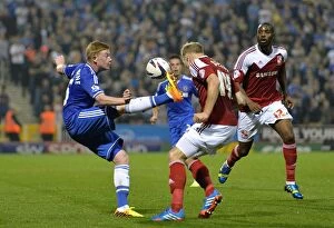 Swindon v Chelsea 24th September 2013 Collection: Battle for the Ball: A Clash Between Kevin De Bruyne and Jay McEveley