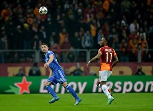Images Dated 26th February 2014: Battle for the Ball: Drogba vs. Cahill - Galatasaray vs. Chelsea UCL Showdown (February 2014)