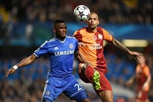 Images Dated 18th March 2014: A Battle for the Ball: Eto'o vs. Melo in the UEFA Champions League Round of 16 Showdown at