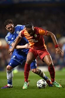 Chelsea v Galatasaray 18th March 2014 Collection: Battle for the Ball: Lampard vs. Drogba - Chelsea's Champions League Showdown (18th March 2014)