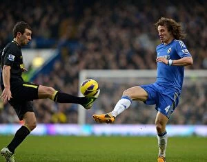 Images Dated 9th February 2013: Battle for the Ball: McArthur vs. Luiz - Chelsea vs. Wigan Athletic, Premier League Rivalry