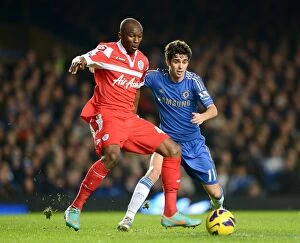 Images Dated 2nd January 2013: Battle for the Ball: Oscar vs. Mbia - Chelsea vs. QPR, Premier League (January 2, 2013)