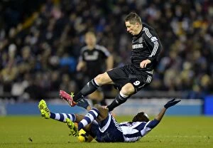 Images Dated 11th February 2014: Battle for the Ball: Torres vs. Mulumbu - West Bromwich Albion vs. Chelsea, Premier League Rivalry