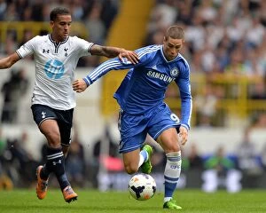 Images Dated 28th September 2013: Battle for the Ball: Torres vs. Naughton - Premier League Showdown between Tottenham and Chelsea