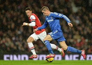 Images Dated 23rd December 2013: Battle for the Ball: Torres vs. Ozil - Arsenal vs. Chelsea Rivalry, Premier League
