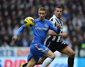 Images Dated 2nd February 2013: Battle for the Ball: Torres vs. Taylor - Newcastle United vs. Chelsea (February 2013)