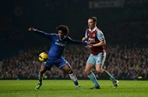 Images Dated 29th January 2014: Battle for the Ball: Willian vs. Nolan - Chelsea vs. West Ham United