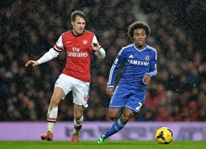 Images Dated 23rd December 2013: Battle for the Ball: Willian vs. Ramsey - Arsenal vs. Chelsea Rivalry, Premier League