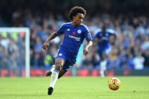 Images Dated 31st October 2015: A Battle at Stamford Bridge: Willian's Unyielding Performance in Chelsea vs Liverpool - Premier