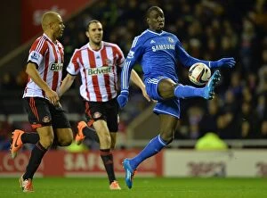 Images Dated 17th December 2013: Battleground Stadium of Light: Wes Brown vs. Demba Ba - A Titanic Rivalry in the Capital One Cup