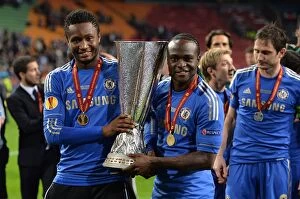 Chelsea v Benfica 16th May 2013 Europa Cup Final Collection: Chelsea Football Club: Mikel and Moses Triumph with the UEFA Europa League Trophy after Epic