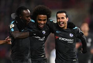 Away Collection: Chelsea Players Celebrate Pedro's Goal in Premier League Match Against Huddersfield Town