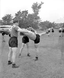 Training Pictures Collection: Chelsea Soccer Training: Harry Medhurst Adjusts Tony Nicholas and Sylvan Anderton's Postures