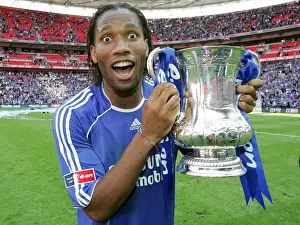 Chelsea's Glory: FA Cup Victory - Didier Drogba Celebrates with the Trophy (May 2007)