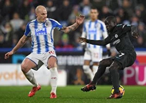 Images Dated 12th December 2017: Chelsea's N'Golo Kante Dodges Huddersfield's Aaron Mooy: Premier League Showdown