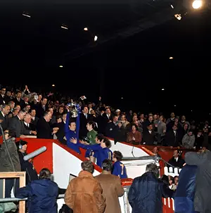 Chelsea's Ron Harris Lifting the FA Cup: A Moment of Triumph with Osgood, Hollins, Houseman, and Baldwin