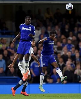 Chelsea v Bolton Wanderers 24th September 2014 Collection: Chelsea's Zouma and Mikel Take on Bolton's Beckford: Intense Moment from the Capital One Cup Third